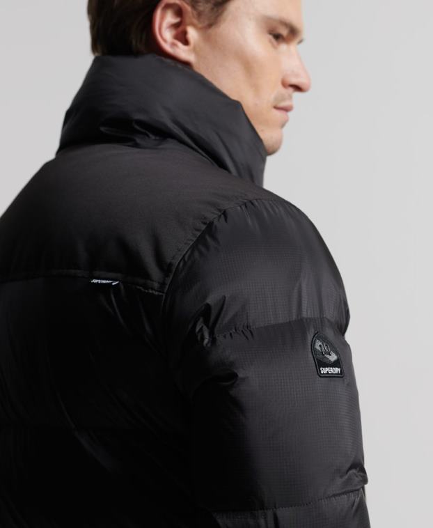 hombres Superdry negro abrigo acolchado con plumas largas 2R68Z4652