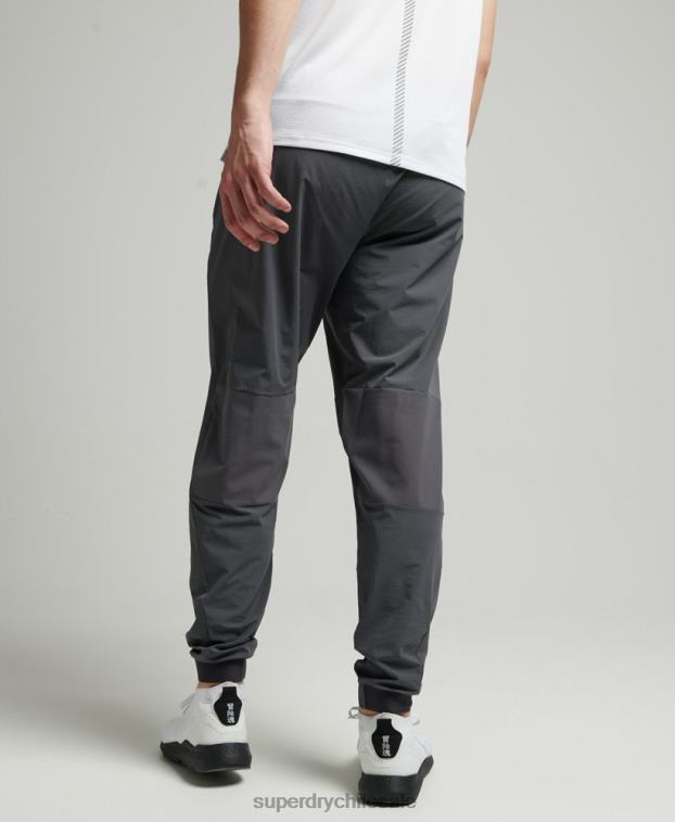 hombres Superdry gris oscuro pantalones de chándal tejidos elásticos 2R68Z5402